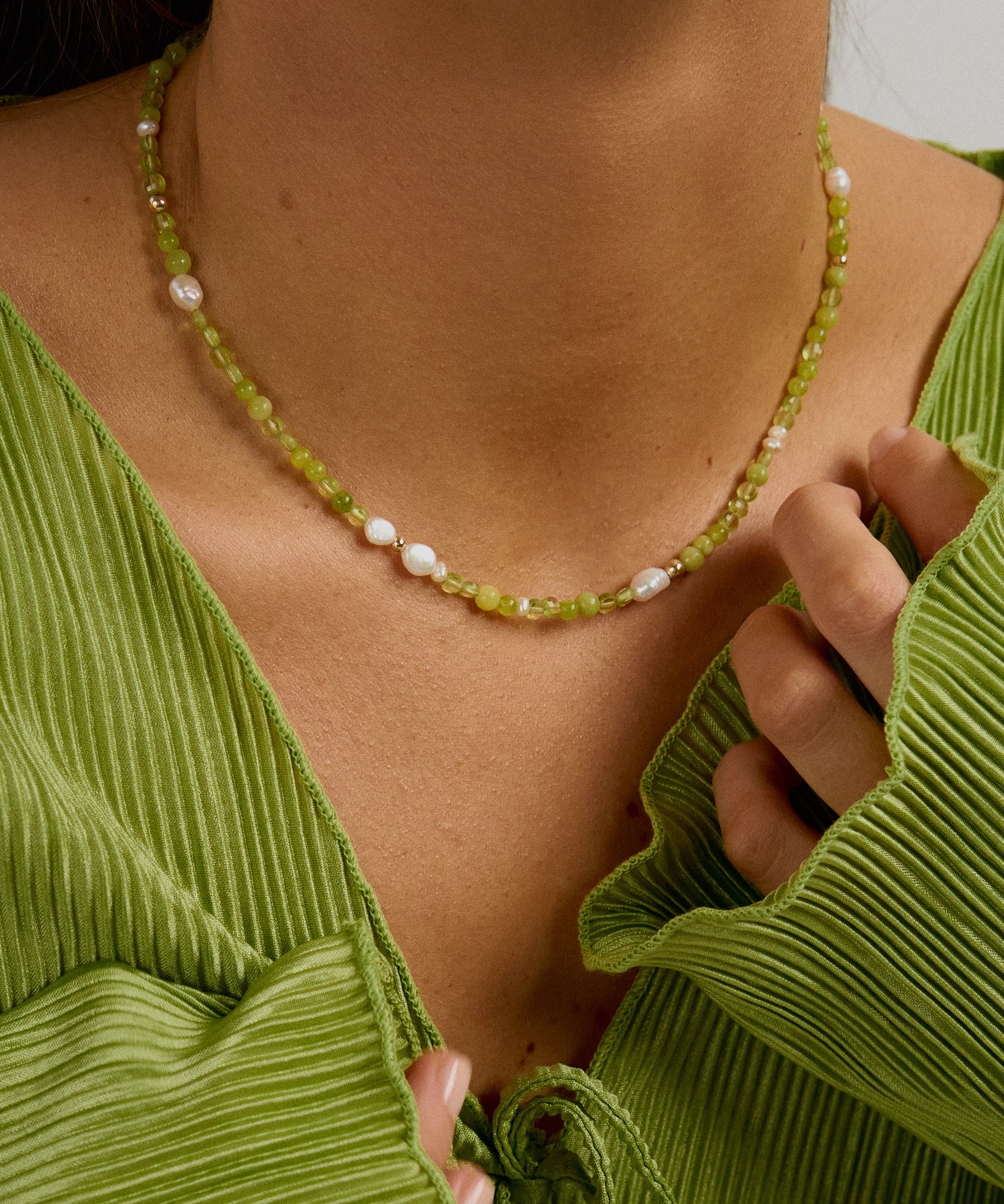 Beaded handmade necklace with peridot, freshwater pearls and green jade.