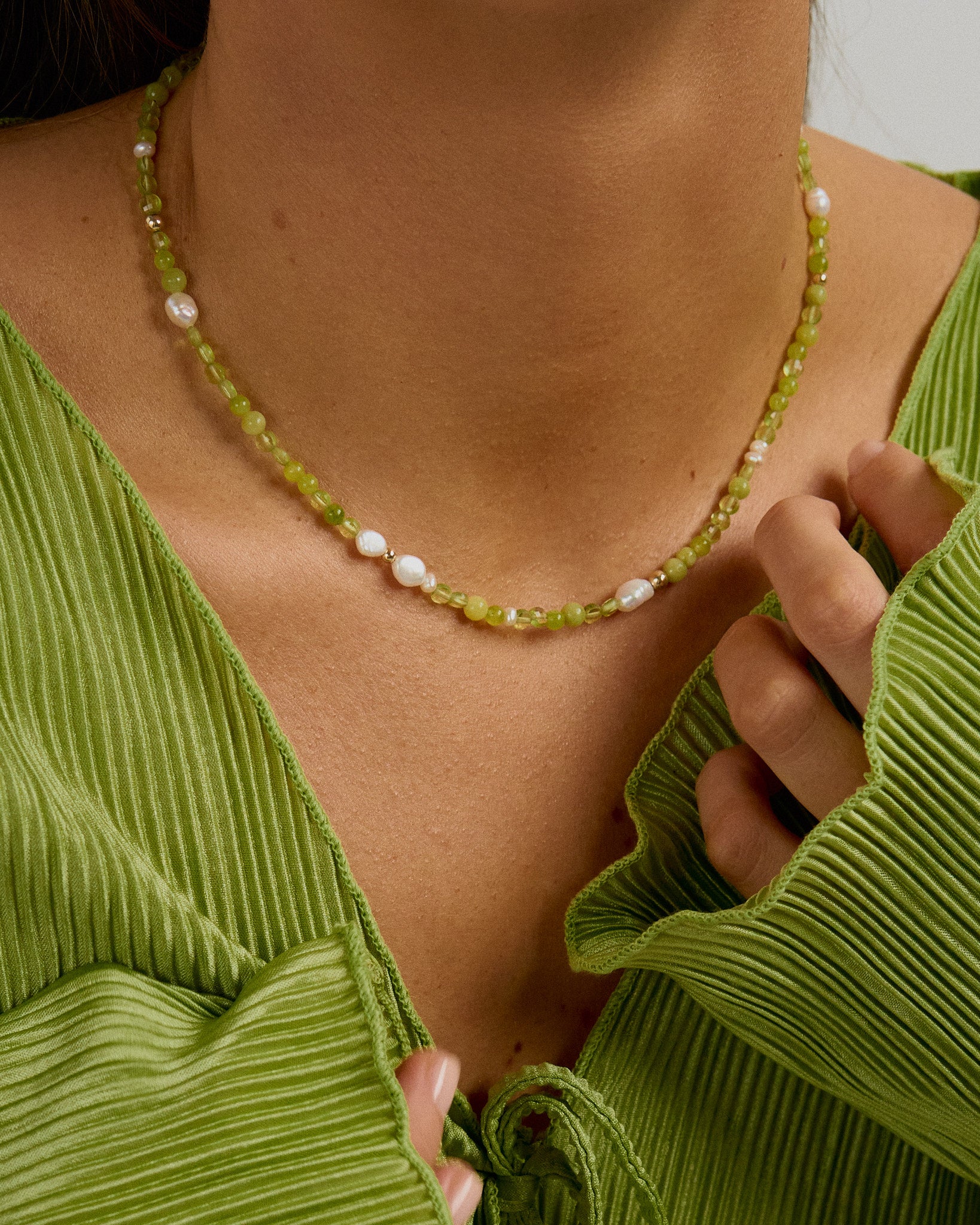 Beaded handmade necklace with peridot, freshwater pearls and green jade.