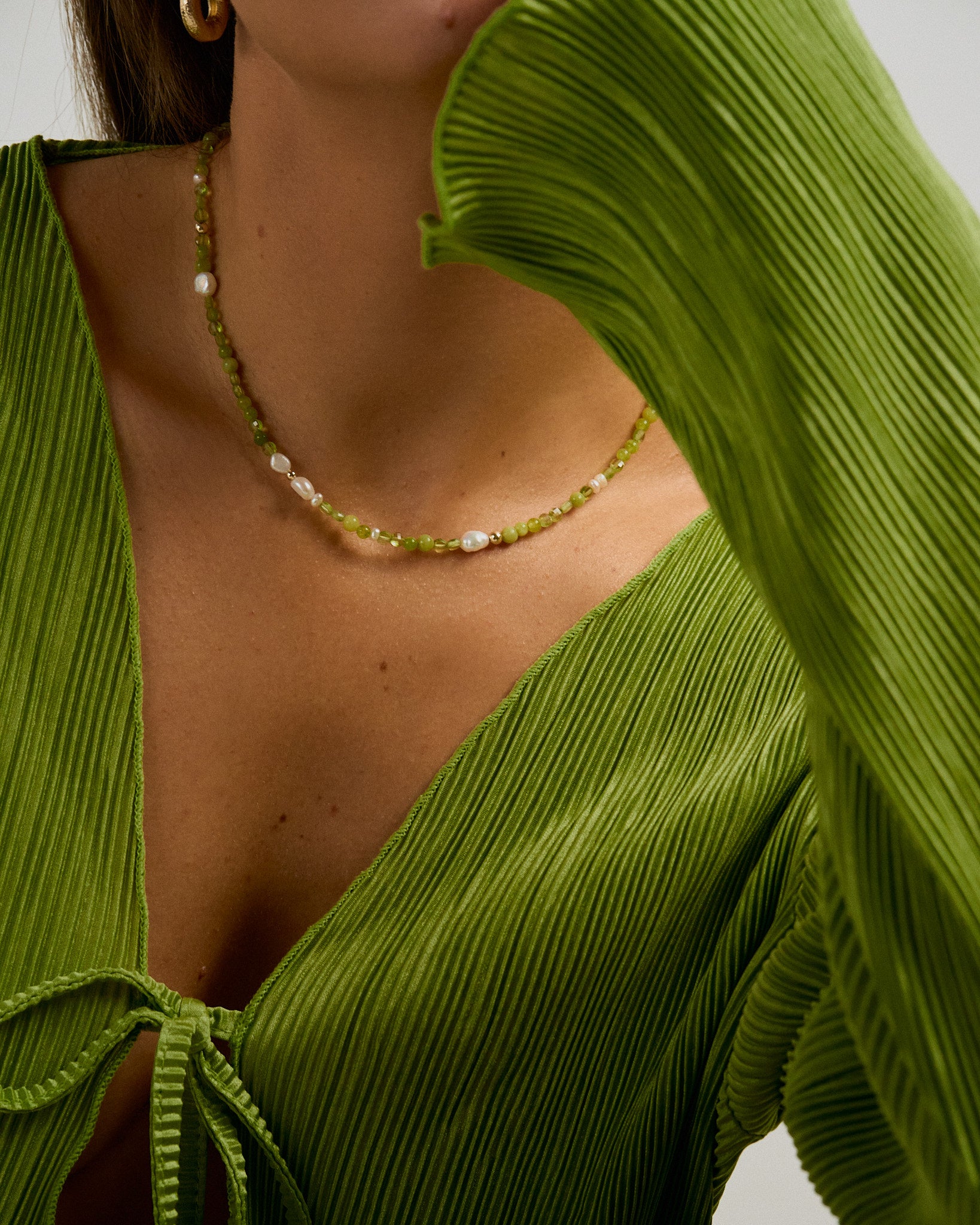 Beaded handmade necklace with peridot, freshwater pearls and green jade.