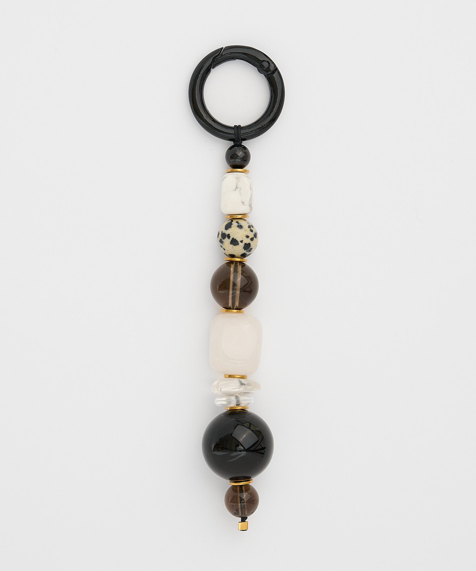 Beaded gemstone keychain with black, white, and brown beads on a white background